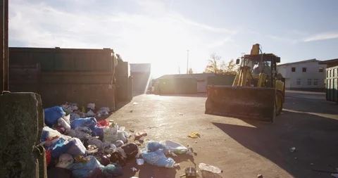 Trash Being Moved Into Garbage Bins At Factory Stock Footage 125364759