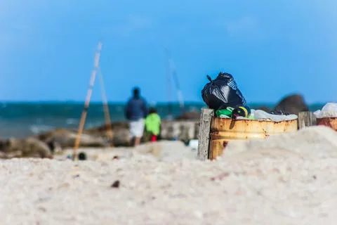 Trash in a bin on the beach contamination full hd Stock Photos