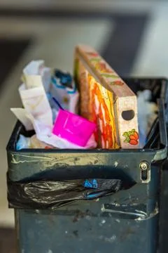 Trash bin full of garbage Stock Photos