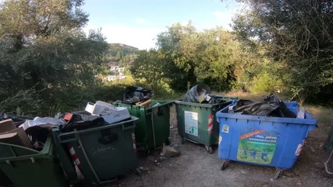 Trash bin waste container dump in countryside rural Greece Stock Footage 141314550