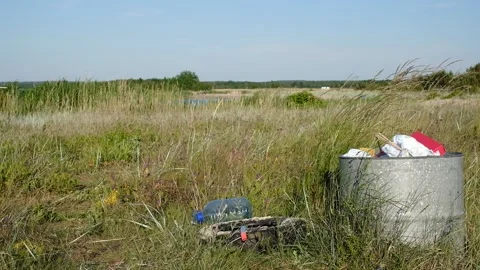 Trash bin on a windy beach Stock Footage 134724537
