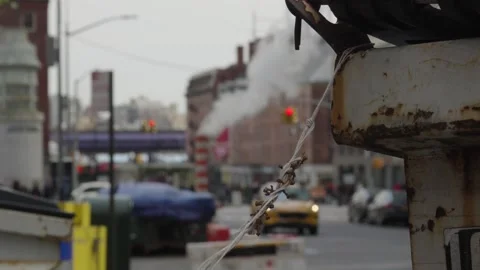 Trash blows in the wind with the backgrop of New York's east side seaport an Stock Footage 241498484