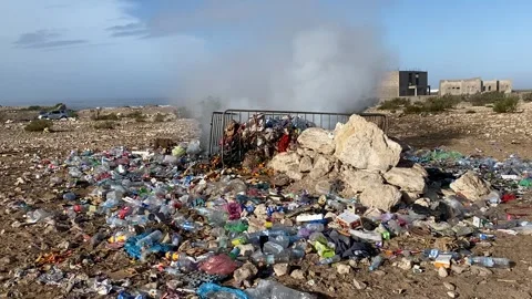 Trash burning on the coast plastic pollution Stock Footage 259843870