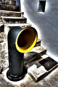 Trash can in front of a staircase Stock Photos