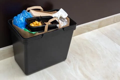 Trash can full of garbage Stock Photos