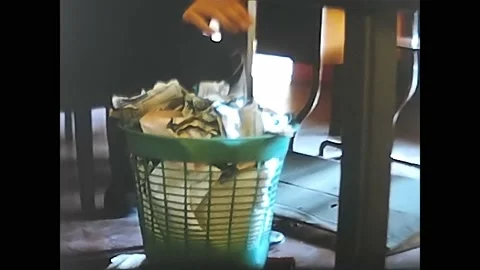 Trash can full of paper in the 60's office 動画素材 196154878