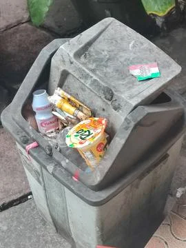 Trash can full of trash Stock Photos