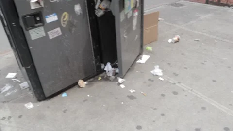 Trash can garbage bin on city street Stock Footage 165356902