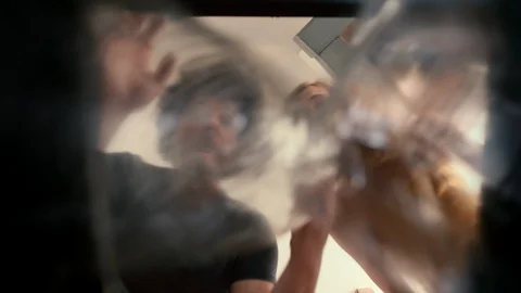 Trash Can Point of View of a Couple hesitating when Recycling Paper and Plast Stock Footage 111446765