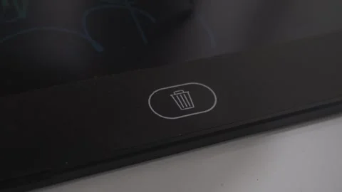 Trash can waste bin button on black screen. Hand pressing on button to delete Stock Footage 251938174