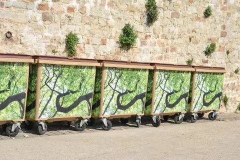 Trash cans garbage standing in a row Stock-Fotos