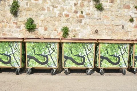 Trash cans garbage standing in a row Stock-Fotos