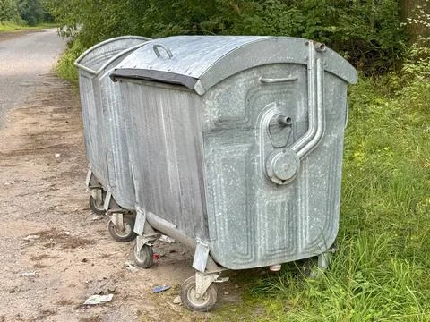 Trash cans in the park with garbage Stock Photos
