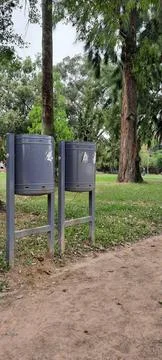 Trash cans in a park Stock Photos