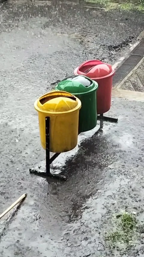 Trash Cans in the Rain Stock Footage 294397037