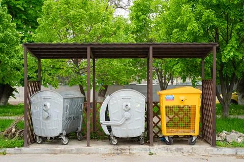 Trash cans on the side of the road Stock Photos