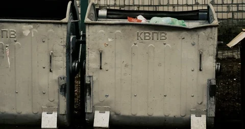 Trash cans on the site for garbage in courtyard of a residential building. Stock Footage 124224885