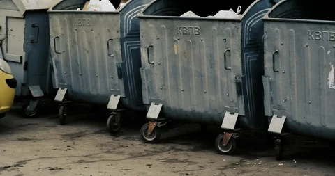 Trash cans on the site for garbage in courtyard of a residential building. Stock Footage 124224915