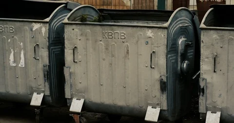 Trash cans on the site for garbage in courtyard of a residential building. Stock Footage 124224958
