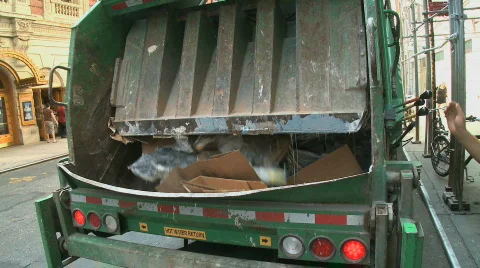 Trash compactor in back of truck Stock Footage 839553