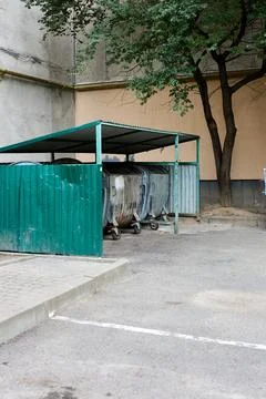 Trash Containers in Enclosure Stock Photos