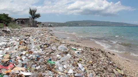 Trash covered beach, city of Saint Marc, Haiti. Stock Footage