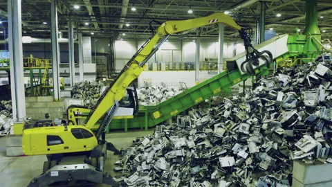 Trash, e-waste, electronic garbage recycling factory. Excavator grabs garbage Video stock 135661207