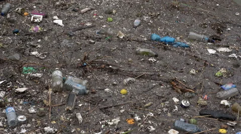 Trash floating on water Stock Footage 55375474