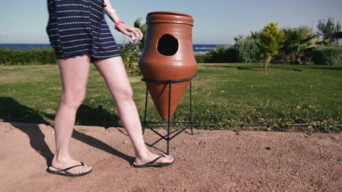 Trash. Girl throws garbage in the trash Stock Footage 107799105
