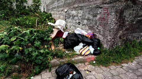 Trash has been dumped at a random location in a neighbourhood Stock Footage 336870743