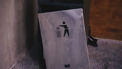 Trash. A metal broken trash bin is standing on the street. Stock Footage 116157121