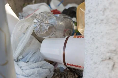 Trash mostly plastic cups, bottles and bags Foto stock