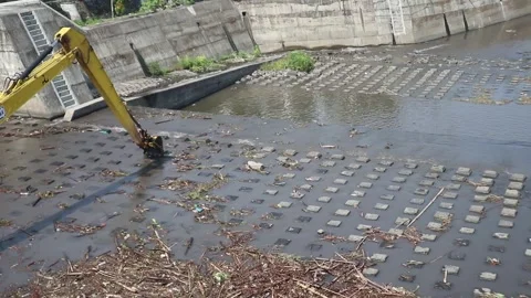 Trash obstructs river flow and damages bridge construction Video stock 337976221