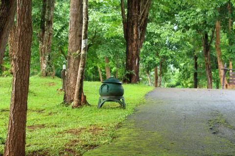 Trash or bin made of tires in forest park. Stock Photos