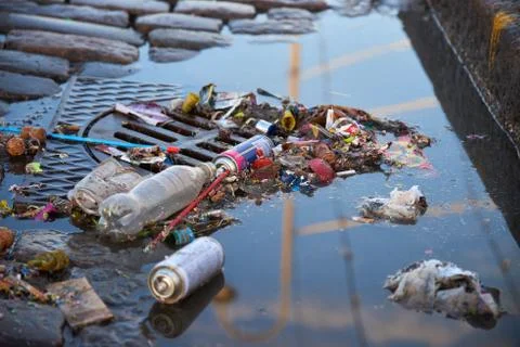 Trash over sewer after first of May celebrations Stock Photos