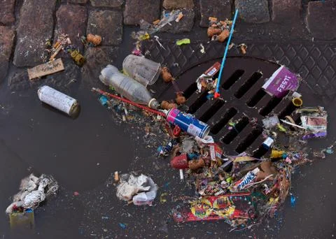 Trash over sewer after first of May celebrations Stock Photos