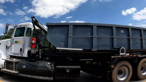 Trash passing by on a highway bridge blue sky with clouds Stock Footage 185453690