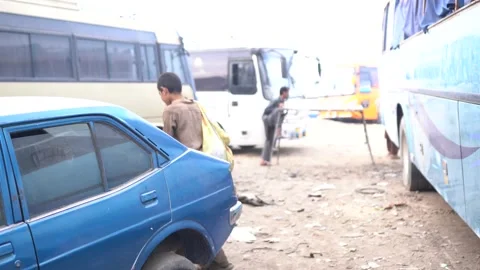 Trash pickers in Bus Yard Stockbeeldmateriaal 194431529