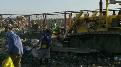 Trash Pickers Collect Garbage in an open dump site Video stock 10576206