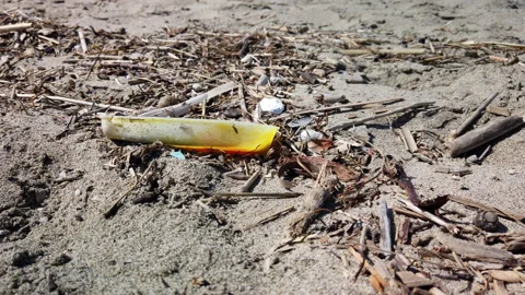 Trash, plastic bottle on the beach. Waste that pollutes the ocean Stock Footage 186782852
