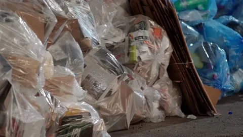Trash on Roadside in NYC. Massive amount of trash from Skyscraper Building Stock Footage 147965559