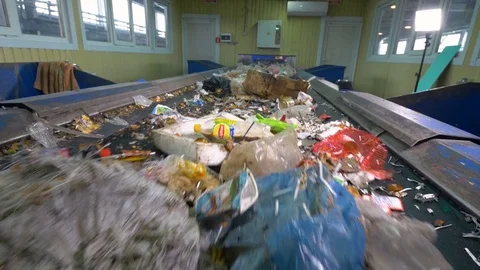 Trash, rubbish, litter on a working sorting conveyor belt in a recycling plant 스톡 동영상 73018053