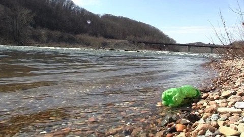 Trash on the shore of a river HD 動画素材 94914946