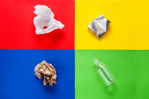 Trash sorting concept. Four colors background for sorting metal, glass. paper Stock Photos