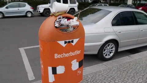 Trash spills out of overfilled Trash Can at Berlin city street - 4K Stock Footage