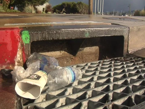 Trash on a storm drain Video stock 609887