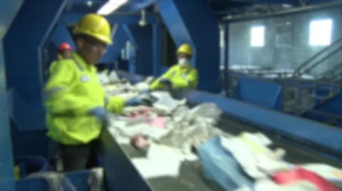 Trash workers on a conveyor (1 of 10) Stock Footage 32283618