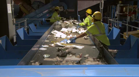 Trash workers on a conveyor (3 of 10) Video stock 32283622