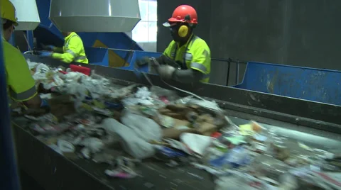 Trash workers weeding through recyclables (2 of 10) Video stock 32283463