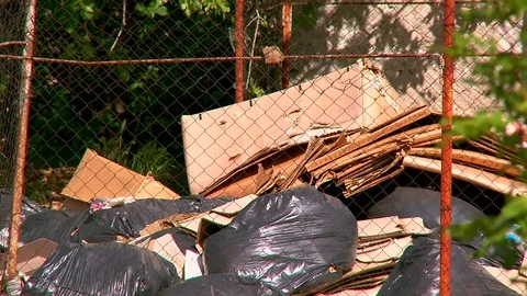 Trash in the yard in front of the building Stock Footage 75171370